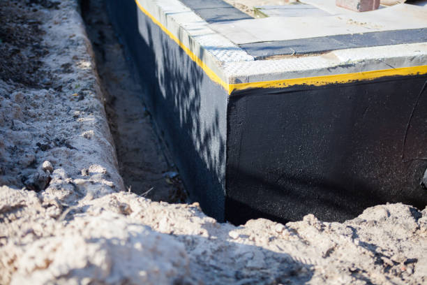 Professional Waterproofing technician working in Lake Grove, NY